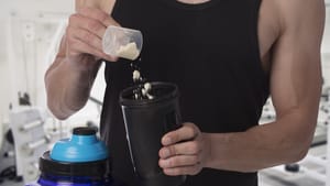 Photo of a man making a weight gainer shake