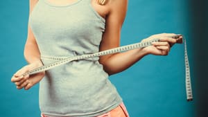 Photo of lady with measuring tape around waist
